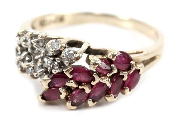 LADIES 14K GOLD DIAMOND & SPINEL RING: 69157 LADIES 14K GOLD DIAMOND & SPINEL RING A beautiful ladies size 8 14K yellow gold ring with 9 marquise cut spinels and 16 round cut diamonds, equaling nearly 1/2 a carat tdw, arranged in a floral