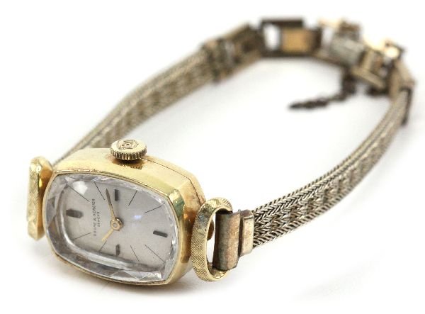 ANTIQUE LADIES 18K GOLD CASE BAUME & MERCIER WATCH: 69177a ANTIQUE LADIES 18K GOLD CASE BAUME & MERCIER WATCH An antique ladies Baume & Mercier wristwatch. Case is 18K gold. Band appears to be gold plated. 17 Jewel Swiss movement. Face measures 16.3mm 