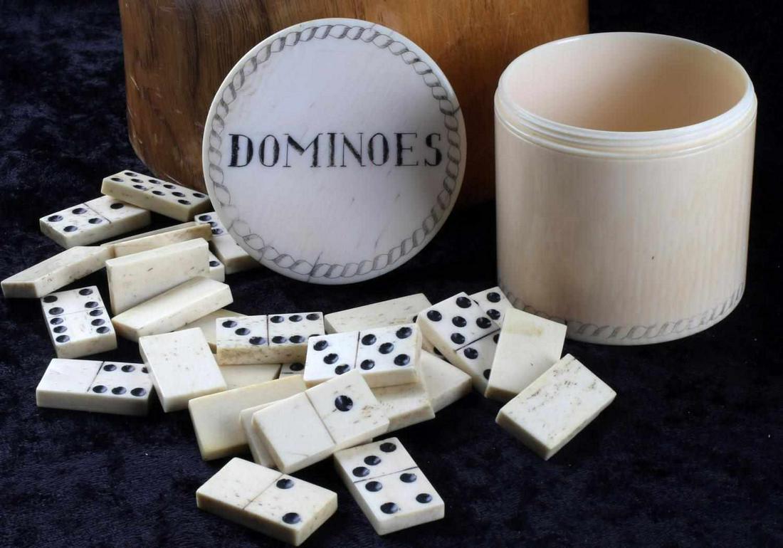 19TH C DOMINOES IN EROTICA SCRIMSHAWED GAME BOX: Antique Ivory Dominoes game box with 28 bone dominoe pieces. Lid reads "Dominoes" on obverse and has a scrimshawed monk with a nude female participating in an sexual act upon the lids reverse. Lid has