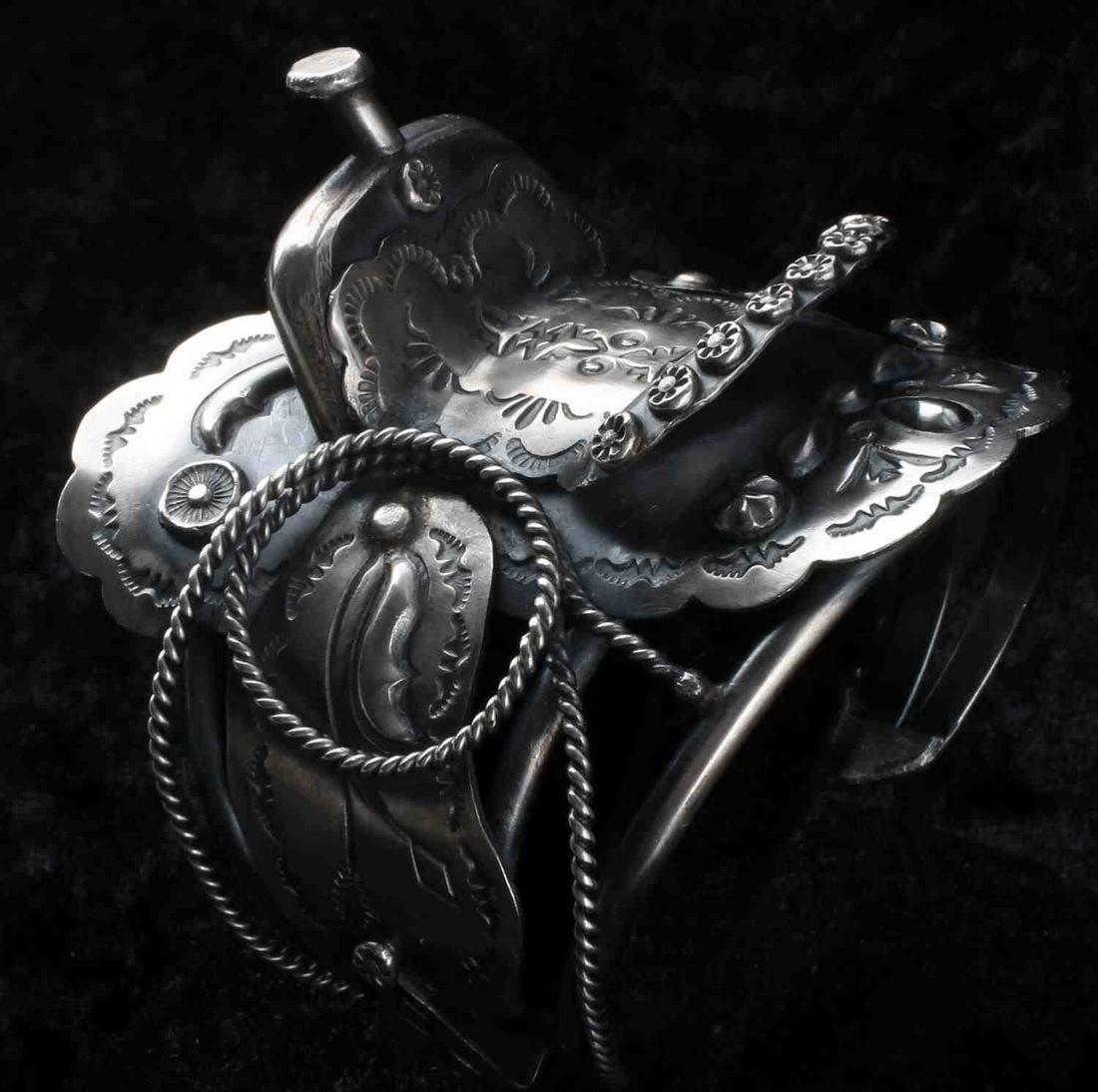 YAZZIE NAVAJO STERLING SILVER SADDLE CUFF BRACELET: Sterling Silver Saddle cuff bracelet crafted and designed by Navajo silversmith TIM YAZZIE. Artist Hallmark: on reverse "T. Yazzie" inscribed on a sterling silver plate. dimensions: 6 3/4 inches inclu