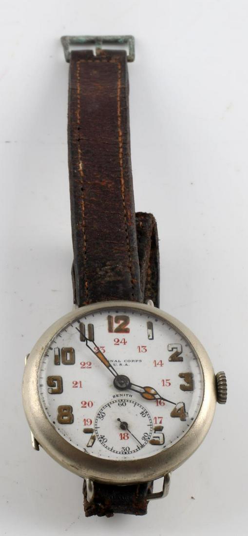 WWI U.S. ARMY SIGNAL CORP MILITARY WRIST WATCH: With original leather band, S/N 2355715, Zenith maker , reverse stamped S.C. USA, enamel face with some loss to numerals, starts and holds on its own, keeps time. Very good original condition.