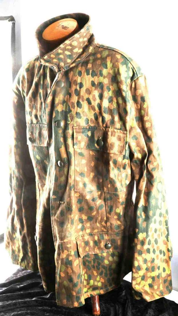 WWII GERMAN REICH WAFFEN SS CAMO TUNIC: WWII German Reich Waffen SS camo tunic with all buttons and pockets in tact. Has no interior tags, but likely fits a medium. In good condition, with no visible rips or tears, looks to be a plan tree p