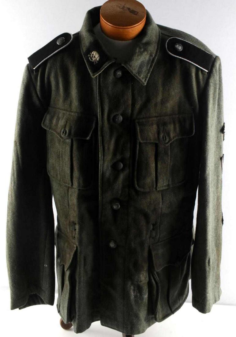 WWII GERMAN THIRD REICH TUNIC SS TOTENKOPF: Third Reich German Army tunic. Interior markings: Paul Opalle & Co, 45 44 96 63 62 on right interior. ZCR 2601 on neck. Fluoresces on totenkopf, Parteiadler, shoulder boards, and SA patches. Possible 