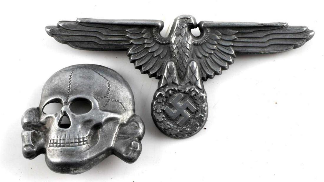 WWII GERMAN THIRD REICH SS EAGLE AND TOTENKOPF SET: SS visor set with eagle and skull in zinc. Marked RZM M1/24 matched set. Very good condition. Skull measures 1 x 1 1/8. Parteiadler measures 1 1/4 x 2 3 /4 inches.