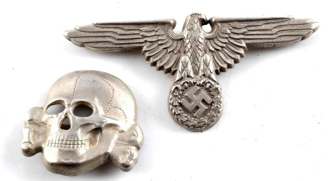 SILVER WWII THIRD REICH SS EAGLE AND TOTENKOPF SET: SS visor set with eagle and skull in silver plated zinc. Marked RZM M1/24 matched set. Very good condition. Skull measures 1 x 1 1/8. Parteiadler measures 1 1/4 x 2 3 /4 inches.