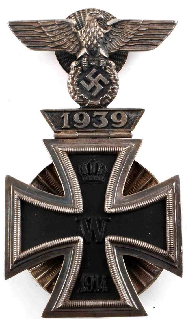 WWII THIRD REICH SILVER IRON CROSS WITH SPANGE: German Third Reich Iron Cross with spange. Hinged eagle type with shell screwback pins. L/12 marked to reverse with 800. Tests for silver. Very good condition. Measures 3 1/4 x 1 3/4 inches. This lot