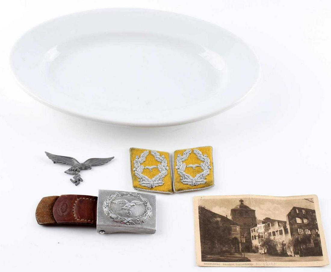 WWII GERMAN LUFTWAFFE PORCELAIN & BADGE GROUPING: WWII German Luftwaffe item grouping to include a porcelain mess hall serving plate measuring 12 1/4 inches wide by 7 3/4 inches long and is marked "Heinrich & C" and "FI. U.V."; a pair of Luftwaffe ma
