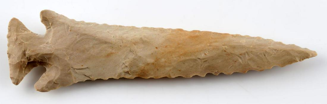 LOST LAKE ARROWHEAD POINT HENDERSON CO. TENNESSEE: Matte Buffalo River chert with bevel to one side of each face, broad flaking, and expanding base. Measures 4 3/8 inches. Very good condition. From Henderson county, TN.