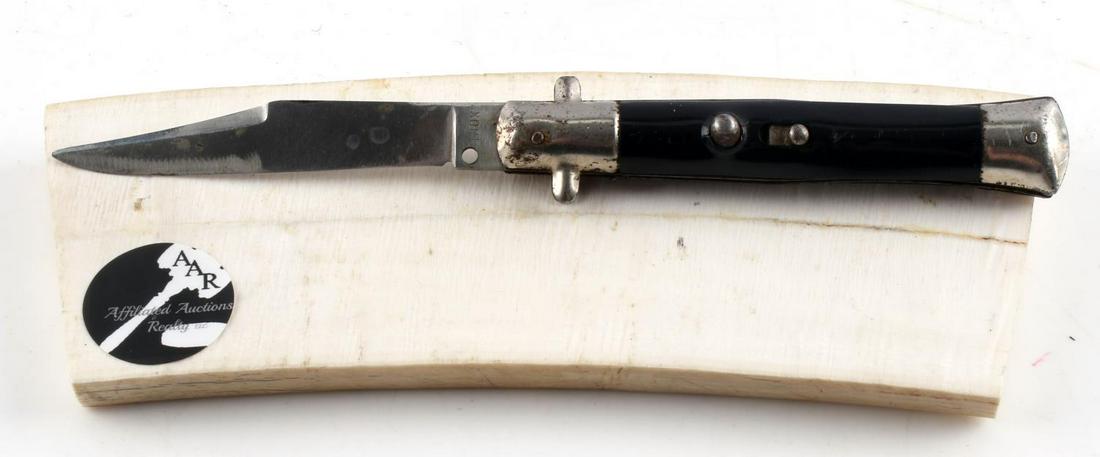 AUTOMATIC NOX STEEL CLIP POINT POCKET KNIFE: Measures 7 inches. Has some rust. Good condition.
