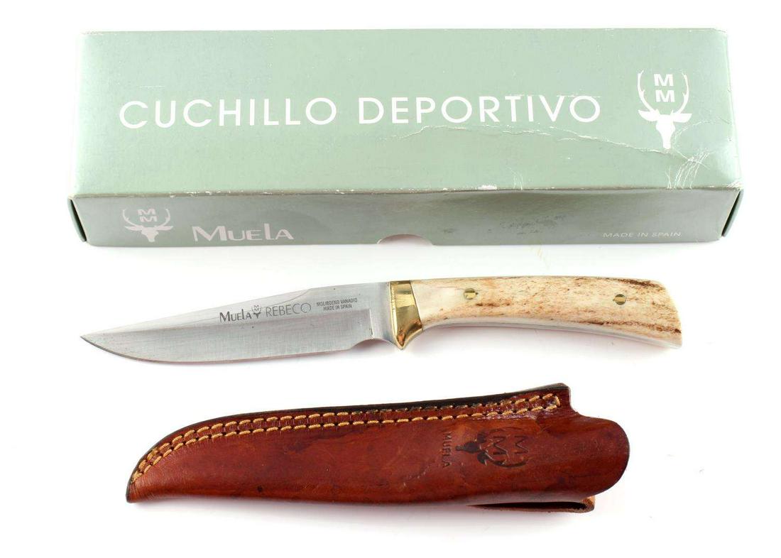 MUELA REBECO STAINLESS STEEL KNIFE WITH SCABBARD: Stainless steel clip point blade, brass bolsters, antler grip. 8 3/4 inches. Very good condition. Made in Spain. Comes with leather scabbard.