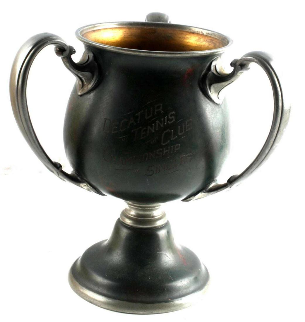 DECATUR TENNIS CLUB CHAMPIONSHIP SINGLES TROPHY: Trophy won by Carl Ramspeck in 1909 and 1910. Stands 8 inches tall. J.K.Orr Jr. 1911 marked to third side. Green patina. Good condition.
