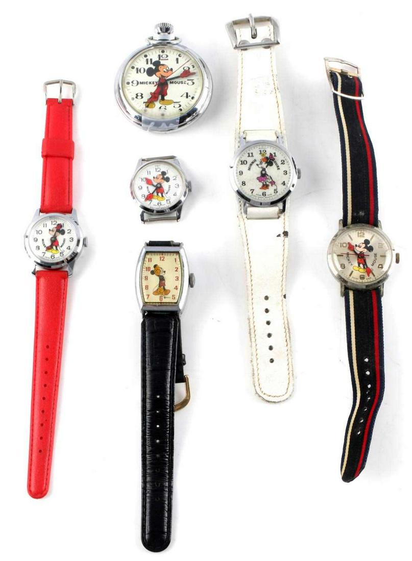 MINNIE & MICKEY MOUSE POCKET & WRIST WATCH LOT: Lot of 5 vintage Mickey Mouse watches. The 4 wrist watches start, 3 hold. 1970's Minnie Mouse Bradley watch starts but does not hold. All in pre-owned condition.