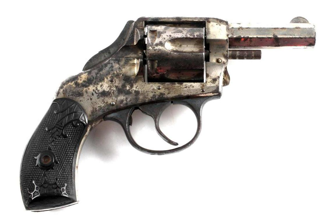 H&R SAFETY HAMMER 6 SHOT DA REVOLVER .32 CAL: Nickel steel revolver with engraved bakelite grips, safety hammer double action marked to top, 2.5 inch octagon barrel with fair bore, maker and caliber marked to left side. Serial number marked to bu
