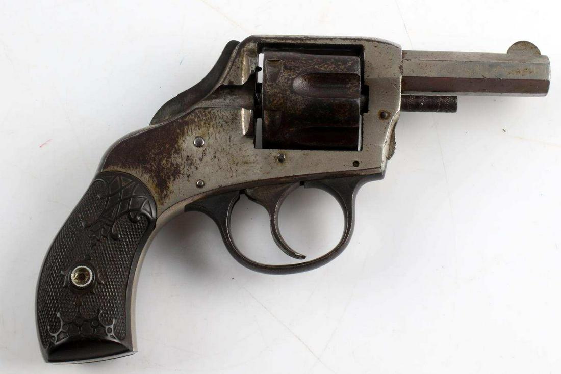 H&R SAFETY HAMMER DA 6 SHOT POCKET REVOLVER .31: Nickel steel with scattered oxidation, maker marked to left barrel flat, 2.5 inch octagon barrel with fair bore, bakelite grips, serial number marked to butt, good condition. Requires FFL or C&R for t