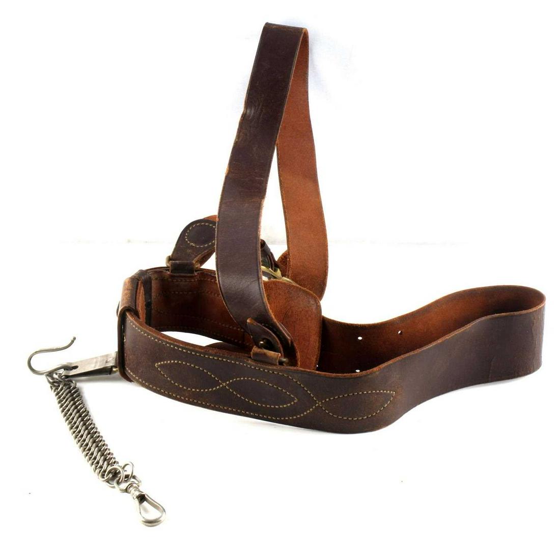 LEATHER SAM BROWN BELT LILLEY AMES W SWORD HANGER: Shoulder strap belt by Lilley Ames, with steel sword hanger attached. Belt interior stamped 186. Very good condition. Belt measures about 30 inches long.
