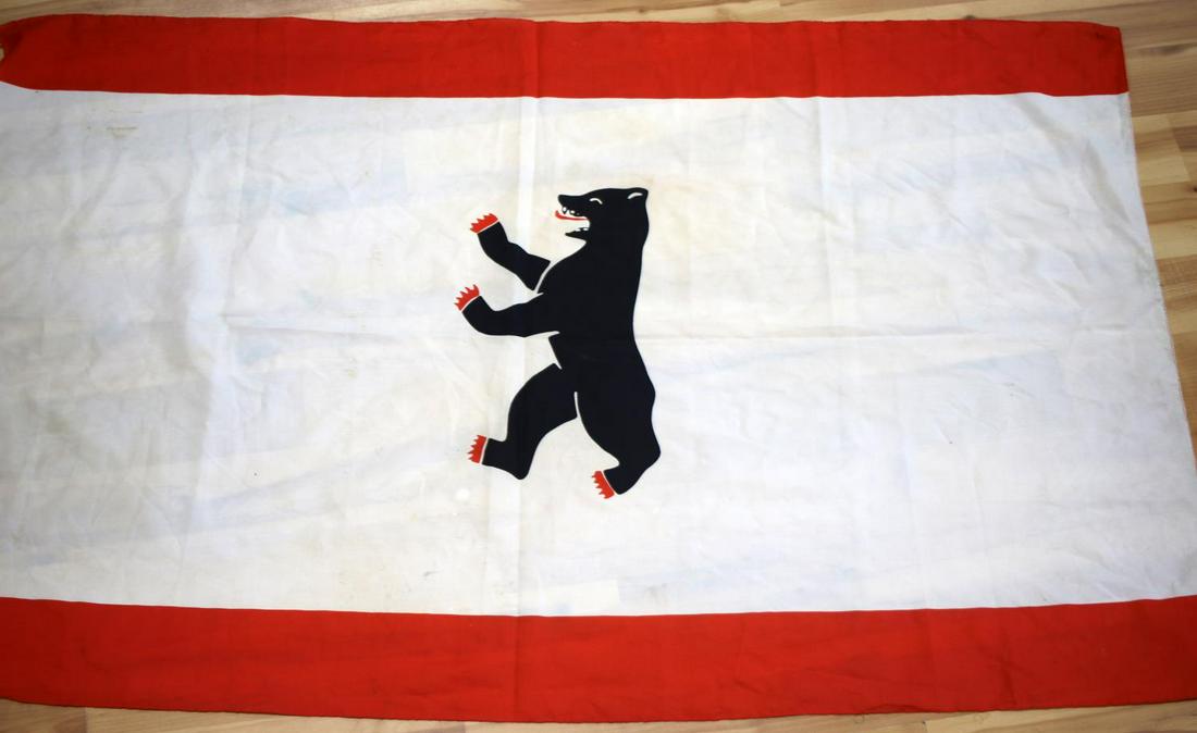 MEDIUM SIZED FLAG OF THE CITY OF BERLIN: Flag of the City of Berlin measuring at approximately 50 3/4 inches wide by 33 3/8 inches tall. In good condition. Flag does not fluoresce.