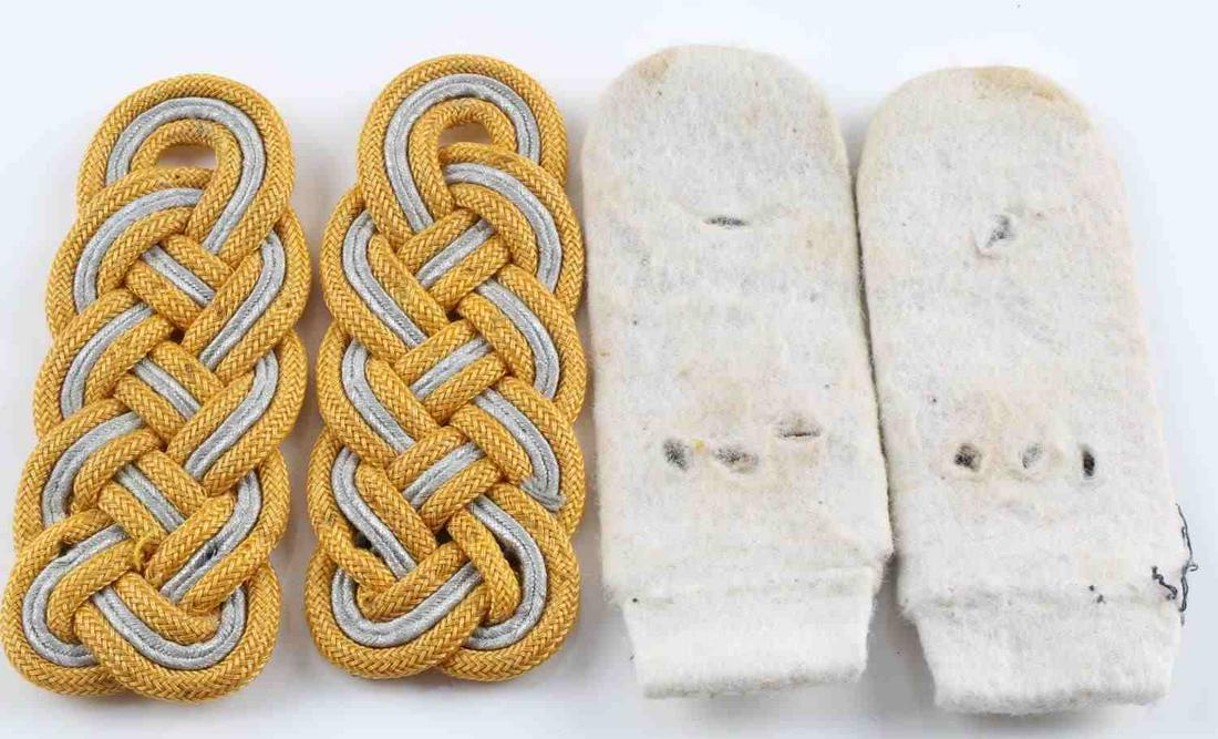 WWII GERMAN LUFTWAFFE GENERAL SHOULDER BOARDS: WWII German pair of Luftwaffe general shoulder boards with gold and silver styled bullion. The stitching between the epaulettes and the fabric which attaches them to the uniform has been severed, leav