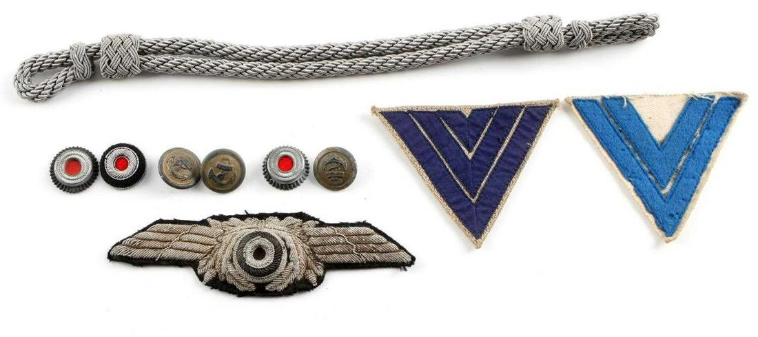 9 WWII GERMAN THIRD REICH PANZER LUFTWAFFE COCKADE: Lot contains Third Reich cockades, buttons, luftwaffe visor wreath, rank insignias. Measurements range 3/4 inches - 12 inches. Good condition. Minimal fluorescing.