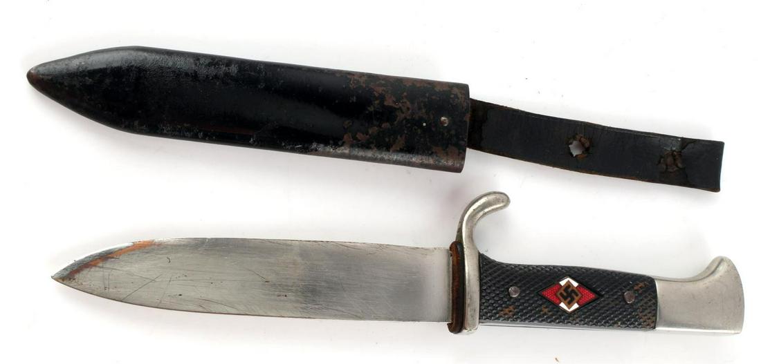WWII GERMAN HITLER YOUTH HJ KNIFE WKC SOLINGEN: Features a 5.25 inch blade, maker marked, leather washer, steel fittings, and checkered black plastic grips with HJ diamond inlay to one side. Blade heavily scratched. Scabbard is oxidized and leather