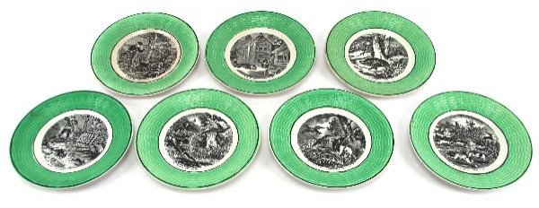 GROUPING OF SEVEN FRENCH HUNTING PLATES: GROUPING OF SEVEN FRENCH HUNTING PLATES Made by Digoin & Sarreguemines, these transfer plates are 7 inches and are green basket weave with black trim and transfer. They depict different hunting scenes
