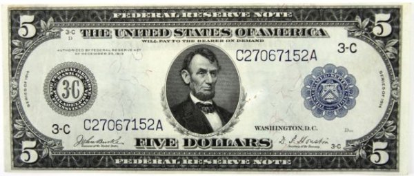 LARGE SIZE FEDERAL RESERVE NOTE 1914 $5 UNC: A CU large size note with a detraction consisting of a stain at 9 o'clock obverse portrait S/N 27067152a series of 1914 Burke/Houston