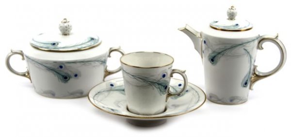 FRENCH 1910 DEMITASSE SET FOR FOUR: FRENCH 1910 DEMITASSE SET FOR FOUR A beautifully hand decorated set of 4 demitasse cups and saucers plus a covered creamer and a covered sugar bowl. Carrying a painted Peacock feather motif. Marks on