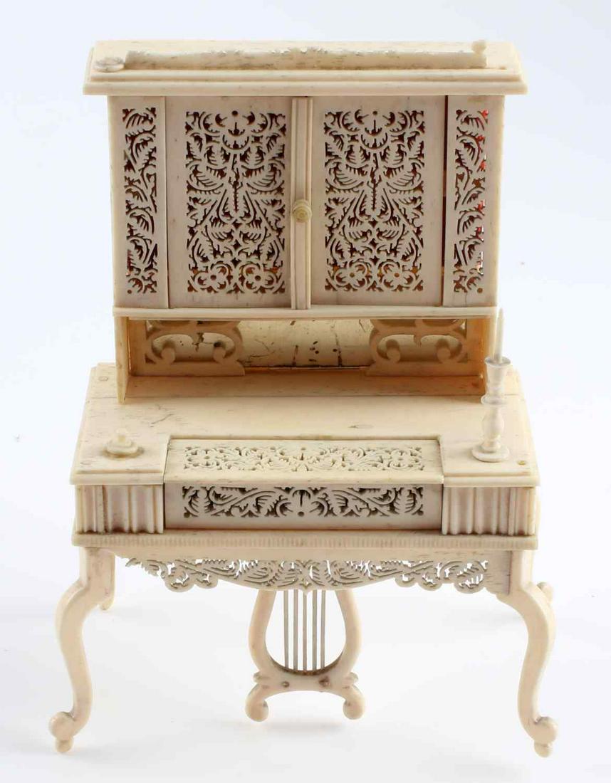 ANTIQUE BONE DOLL HOUSE PUMP ORGAN PIANO: Some parts missing like a candle stick and a bit out of balance, early piece probably 19th century, 4 x 5 inches.