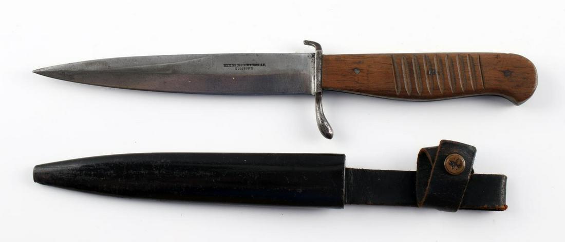 WWI IMPERIAL GERMAN TRENCH FIGHTING KNIFE: Great blade, stamped Deutsche Maschinenfabrik A.E. Duisburg, reverse stamped D.R.G.M. at ricasso, very good original condition. 10 inches overall, original very good scabbard.