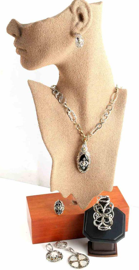 CAROLYN POLLACK RELIOS SOUTHWEST STERLING SILVER: Designer sterling silver, brass, MOP and onyx jewelry created by Navajo silver artisan Carolyn Pollack. Lot includes one 20 inch necklace with 3 interchangeable pendants, scrolling hoop earrings, 1 1/
