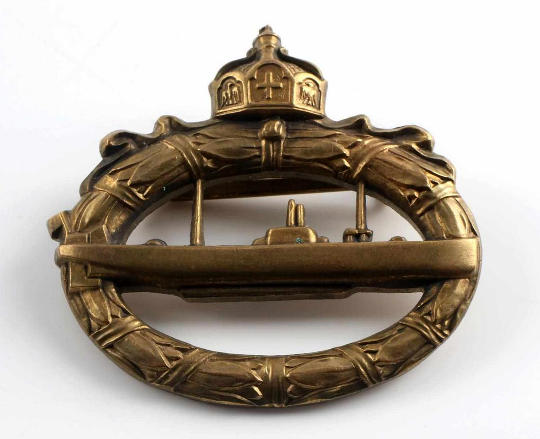 WWI IMPERIAL GERMAN U-BOAT BADGE WALTER SCHOTT: WWI Imperial German U-Boat badge by Walter Schott. Stamped "Walter Schott Fec" on the reverse. Measures approximately 2 X 2 inches with a 180 degree pin lie. Very good condition overall. This lot has