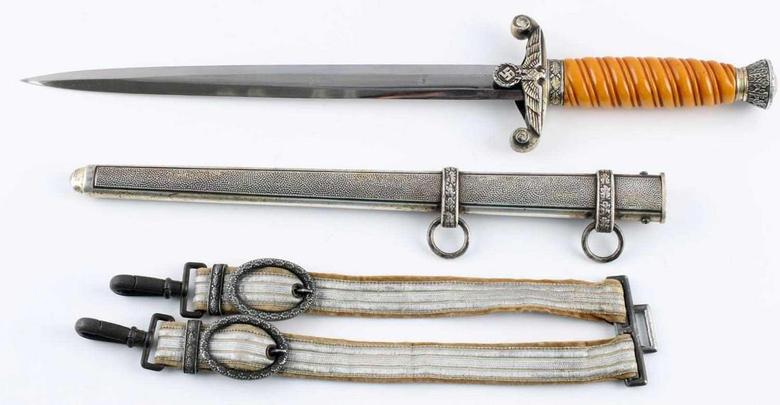 WWII GERMAN THIRD REICH ARMY OFFICER KLAAS DAGGER: Third Reich Army Officer dagger. Pebble scabbard, bakelite grip, matching dagger hangers. Blade marked Rob Klaas Solingen. Blade measures 10 inches. Overall 14 1/2. Good condition. Non-fluorescing. Th