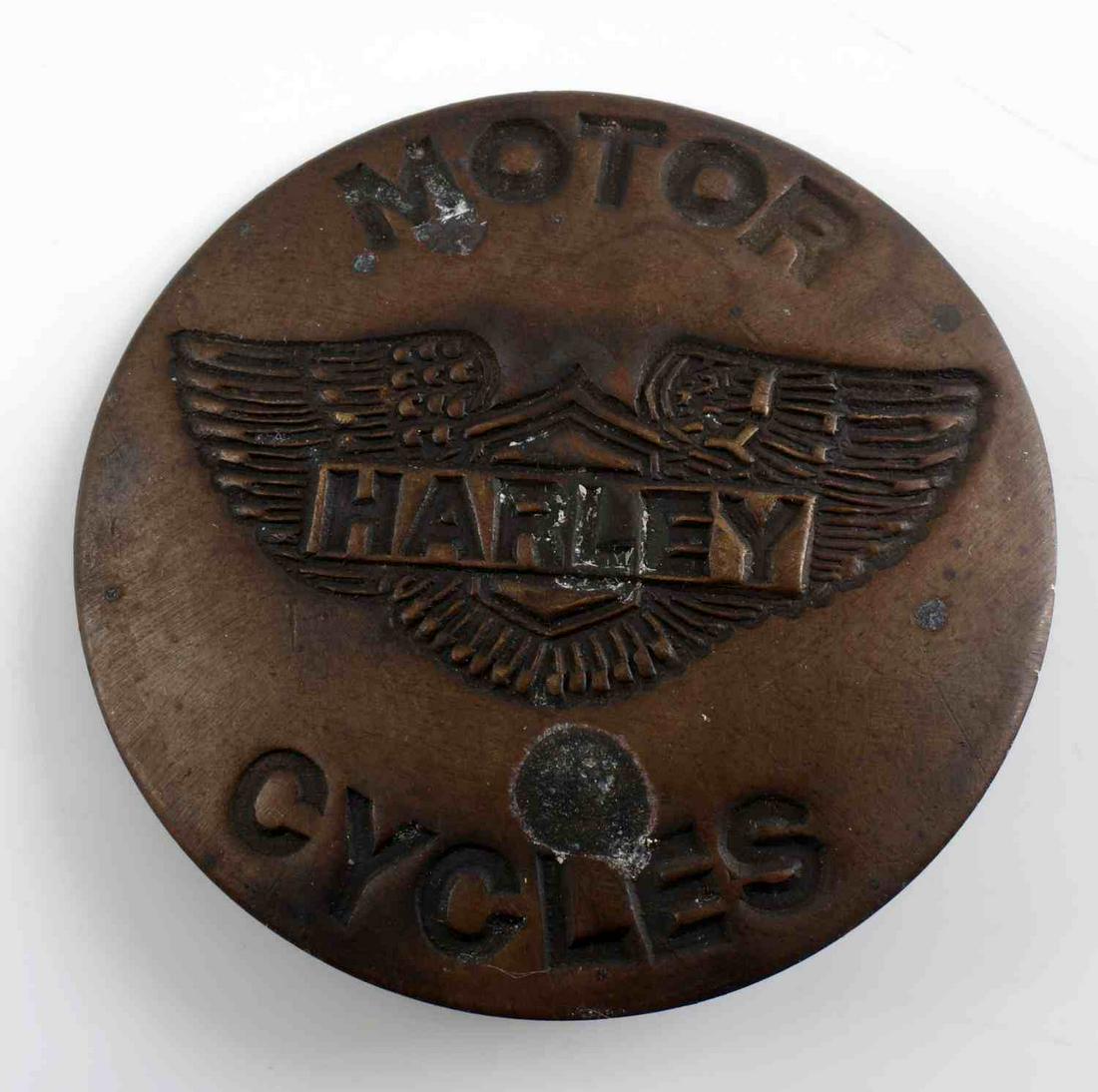 VINTAGE HARLEY DAVIDSON HD MOTORCYCLE BADGE: Vintage Harley Davidson HD Motorcycles Badge. Measures 1 3/4" in diameter. The front reads ‘Harley Motor Cycles’ with their winged logo in the back ground. Has a thin vertical safety pin back. Vau