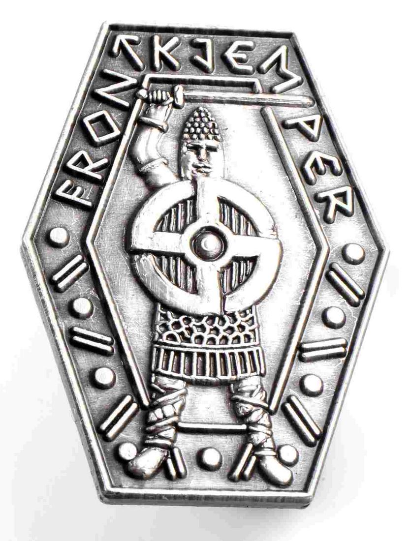 WWII GERMAN THIRD REICH FRON KTEM PER BADGE: German WWII FRON KTEM PER Swastika Viking Badge. Measures 1 1/8” wide by 1 1/2" tall. The front reads ‘FRON KTEM PER’. There is Viking warrior with a sword in his hand and a swastika in the cent