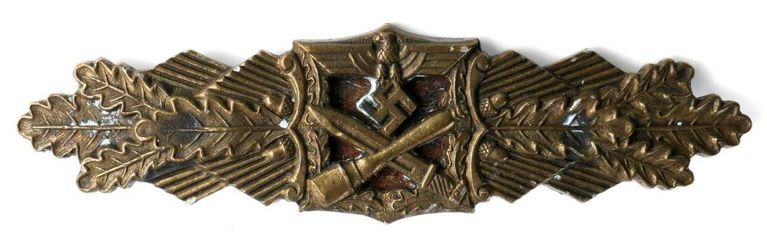 WWII GERMAN ARMY BRONZE CLOSE COMBAT CLASP: WWII German Army Bronze Close Combat Clasp. The front shows an army eagle with a crossed stick grenade and bayonet below. All three are flanked by oak leaves on each side. The reverse is maker marked 
