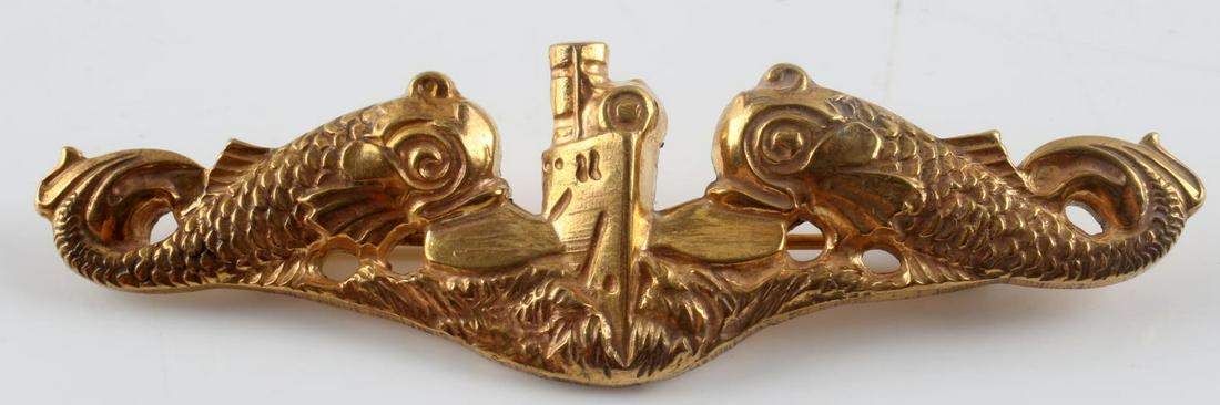 WWII US NAVY SUBMARINE OFFICERS DOLPHIN BADGE: USN World War II Naval Submarine Officers Dolphin Breast Badge. Measures 2 3/4" wide by 13/16” tall. The front shows a submarine hull in the center flanked by a dolphin on each side. The reverse is 