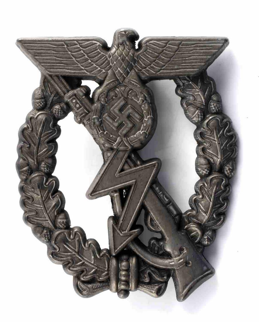 WWII GERMAN ARMY PROTOTYPE SILVER ASSAULT BADGE: Obverse shows a lightning bolt in the center with a Mauser K-98 rifle in the back ground with a Reichsadler at the top surrounded by an oak leaf wreath. Thin vertical pin back with a ‘c’ catch. Di