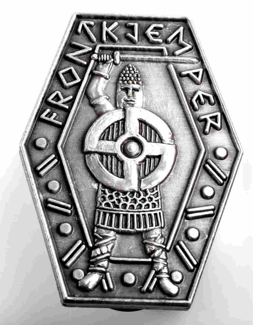 WWII GERMAN THIRD REICH FRON KTEM PER BADGE: German WWII FRON KTEM PER Swastika Viking Badge. Measures 1 1/8” wide by 1 1/2" tall. The front reads ‘FRON KTEM PER’. There is Viking warrior with a sword in his hand and a swastika in the cent