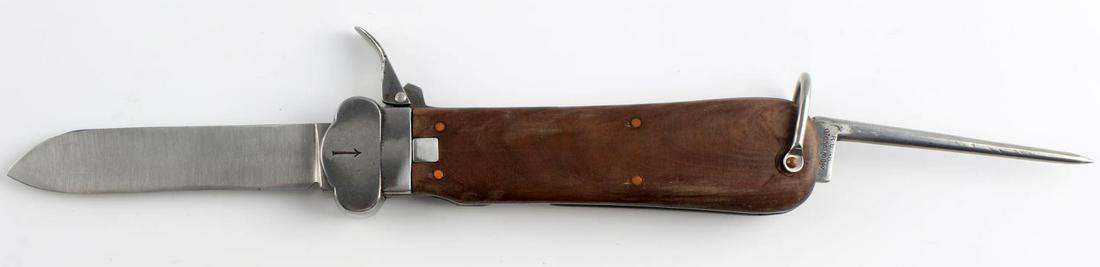 WWII GERMAN LUFTWAFFE PARATROOPER GRAVITY KNIFE: WWII German Third Reich Luftwaffe Paratrooper gravity knife. Measures around 10 inches with blade open, with a 4-inch blade. Steel spike measures around 4 inches. Spike is marked with "6" and "R. B. N