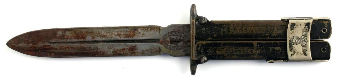 WWII GERMAN EICKHORN FOLDING PARATROOPER KNIFE: WWII German Waffen SS folding paratrooper knife. Handle marked "RZM M7/66/34/SS" and "SS - Streifendie". Reichsadler on holding clip. Blade marked with Eickhorn makers mark. Measures 8 inches. Good co