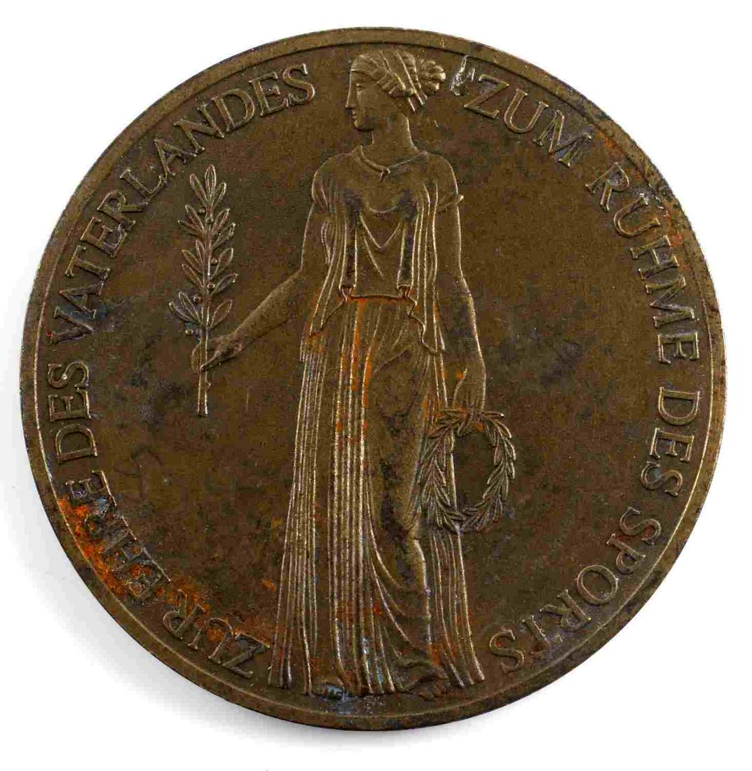 WWII GERMAN THIRD REICH SUMMER OLYMPIC TABLE MEDAL: Measures 1 3/4 inches in diameter. Has some discoloration but in overall good construction. Bronze construction. Has German writing around the edge. Unauthenticated, sold as is.