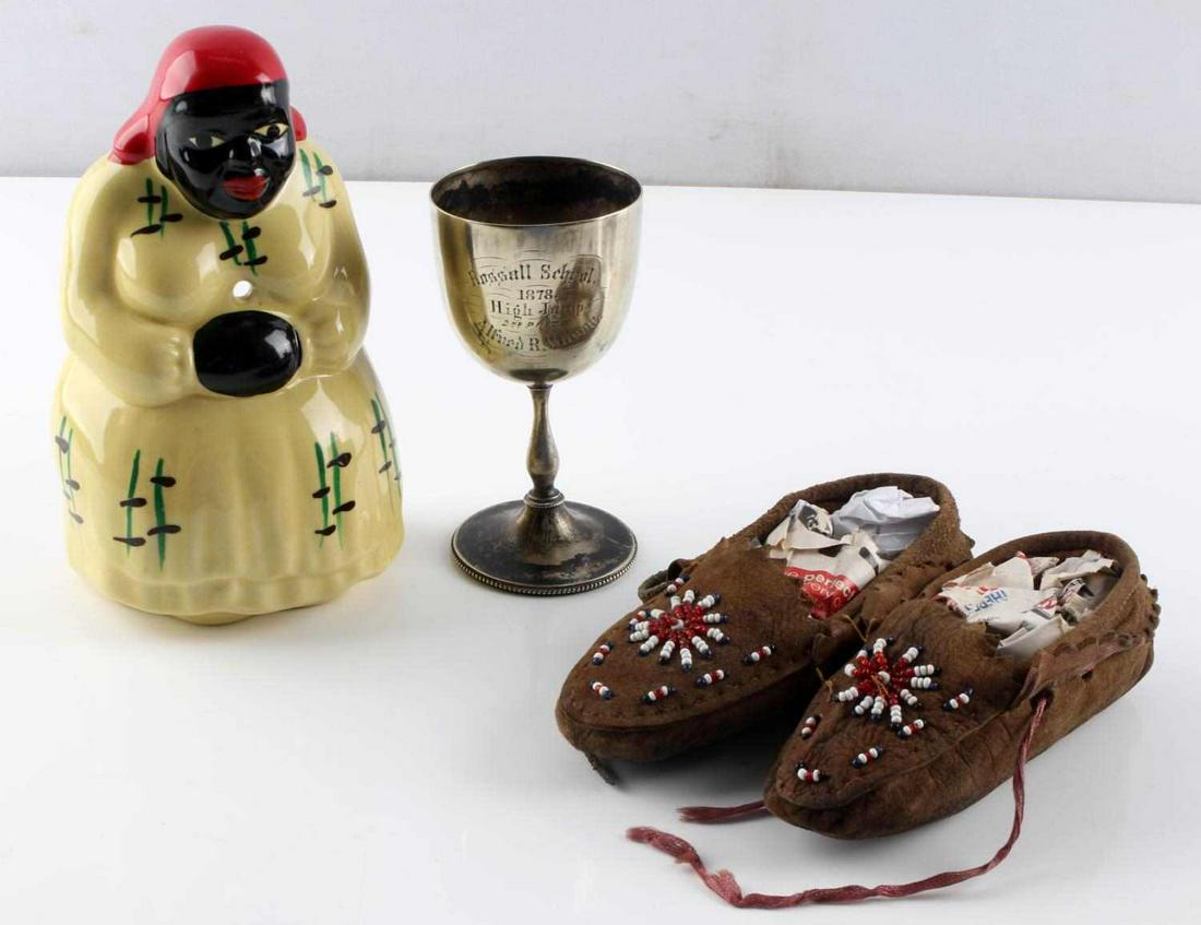 ANTIQUES MCCOY MAMIE 1878 TROPHY INDIAN MOCCASINS: Includes McCoy embossed wall hanging Mamie 6 1/2 inches, free of detractions. Child's beaded plains Indian brain tanned leather moccasins, and 1878 High Jump 4 1/2 inch trophy From Russel school award