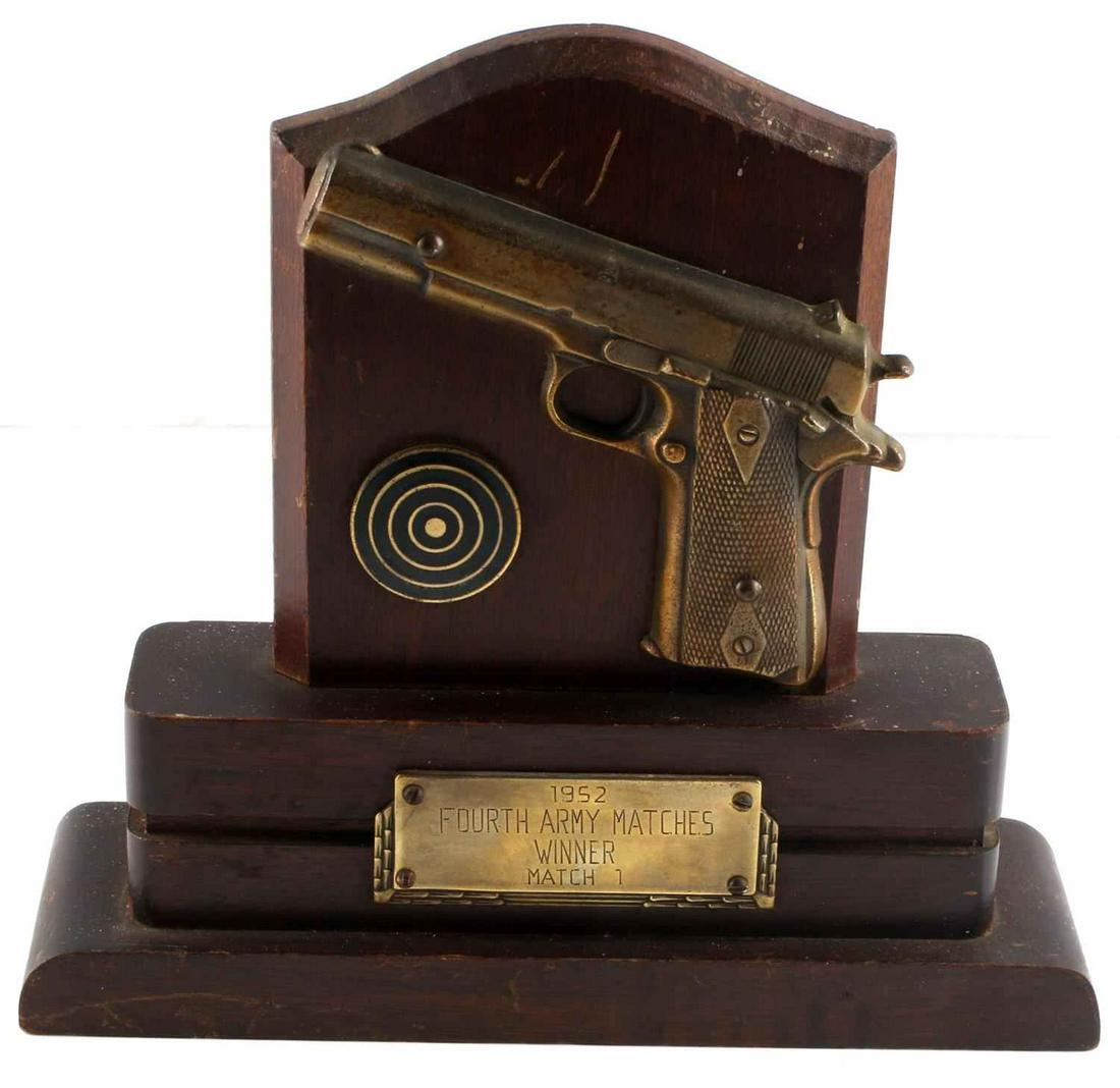 1952 KOREAN WAR COLT 1911 PISTOL MATCH TROPHY: Brass 1911, target and match info n wood, measures 8 by 8 inches. Some scratches otherwise very good.
