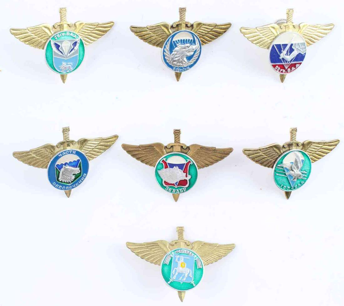 7 RUSSIAN FEDERATION PARATROOPER WING BADGES: Set of 7 Russian Federation paratrooper wing badges measuring 1 11/16 inches tall by 2 7/16 inches wide. In good condition, featuring different enamel designs on each badge. Unauthenticated, sold as i