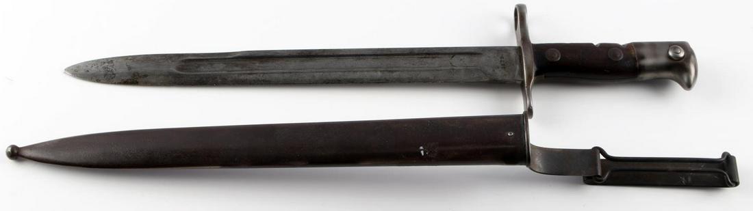 1898 SPAN AM U.S. KRAG RIFLE BAYONET W HANGER: Dated 1898 stamped U.S., slight loss to blade, dent free scabbard, good hanger.