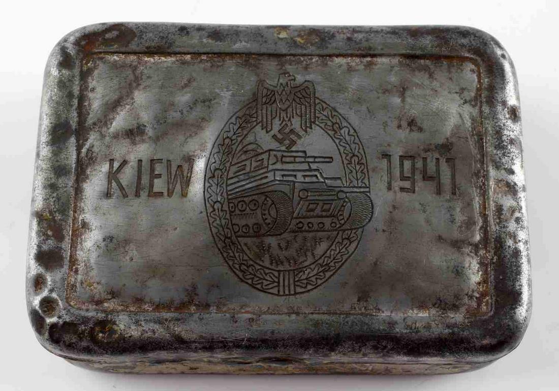 WWII GERMAN THIRD REICH BATTLE FOR KIEV 1941 CAN: Third Reich trinket box for the Battle of Kiev. Features a panzer with a Parteiadler. Measures 3 1/4 inches. Good condition with age wear. Unauthenticated, sold as is. This lot has a reserve.