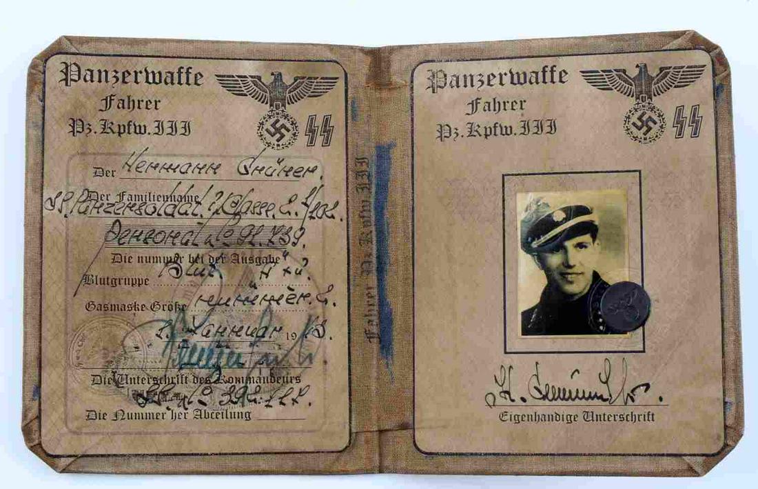 WWII GERMAN REICH AUSWEIS ID PANZERMAN BOOKLET: WWII German Third Reich Ausweis ID booklet of a Waffen SS Panzer division. Inside features photo and signature. Brown cloth material. Unauthenticated, sold as is. This lot has a reserve.