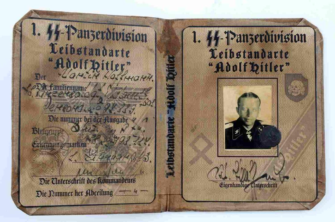 WWII GERMAN AUSWEIS SS PANZER DIVISION ID BOOKLET: German WWII Ausweis ID of a Waffen "SS" Panzer division from the Leibstandarte "Adolf Hitler". Features Totenkopf shield designs, runes, and the Reichsadler. Brown, cloth material. Unauthenticated, so