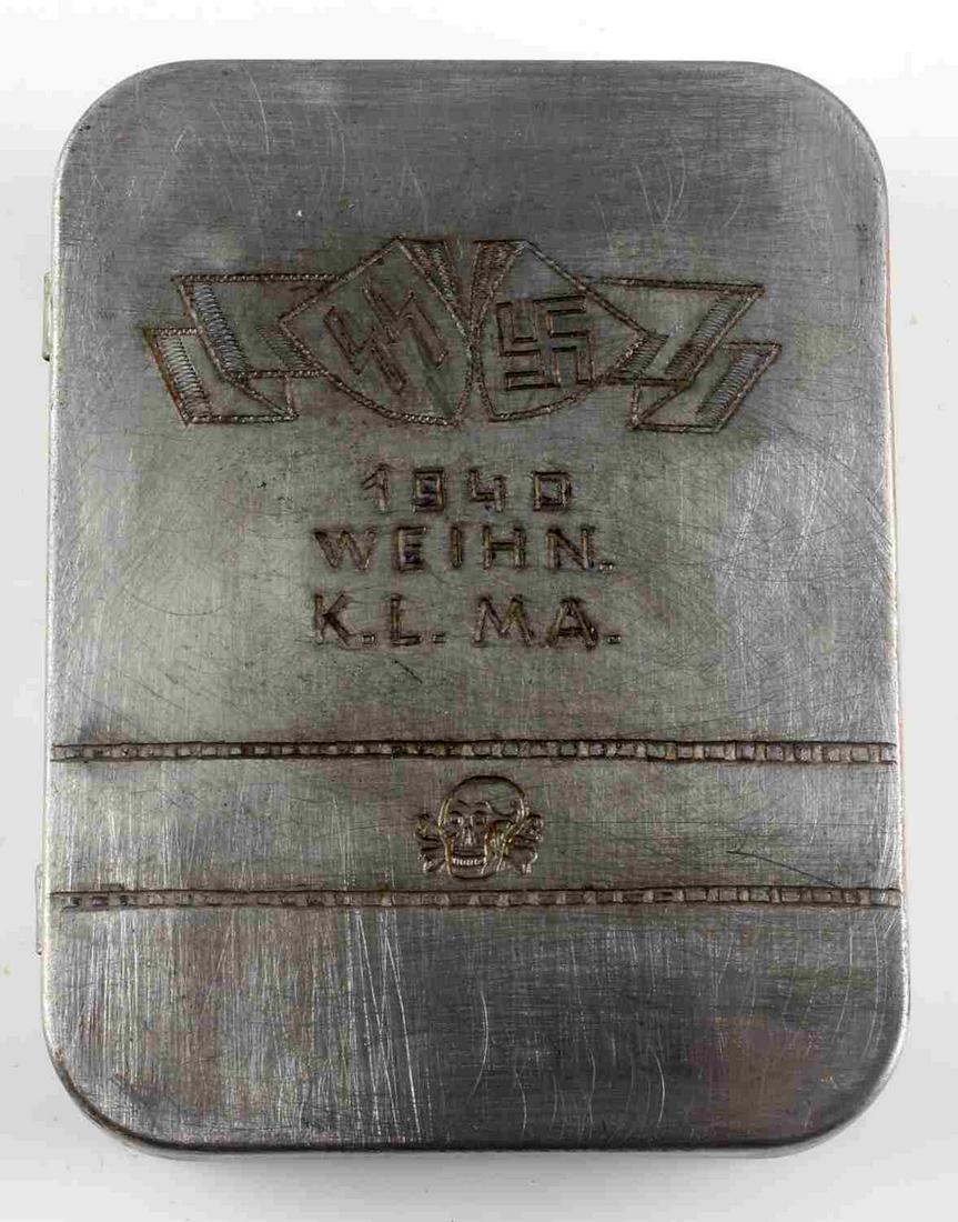 WWII MAUTHAUSEN CONC CAMP SS GUARD PILL BOX: Aluminum trinket / pill box belonging to an SS guard from the Mauthausen concentration camp. Etched to front (1940 Weihn K.L.M.A.) along with SS runes, swastika, and totenkopf. Measures 3.25 X 2.5 inc