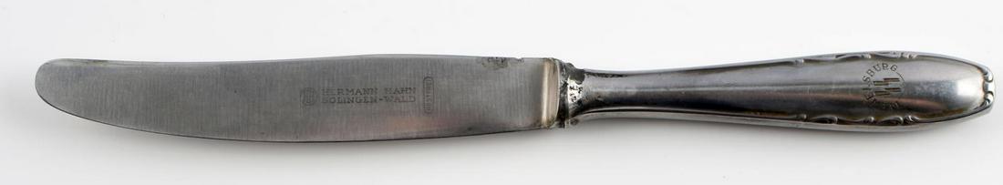 WWII GERMAN WAFFEN SS WEWELSBURG BUTTER KNIFE: WWII German Waffen SS Wewelsburg butter knife. Handle marked Wewelsburg insignia with SS runes. Blade marked to obverse HH Hermann Hahn Solingen-Wald Rostfrei with reverse handle marked Remanit. Light
