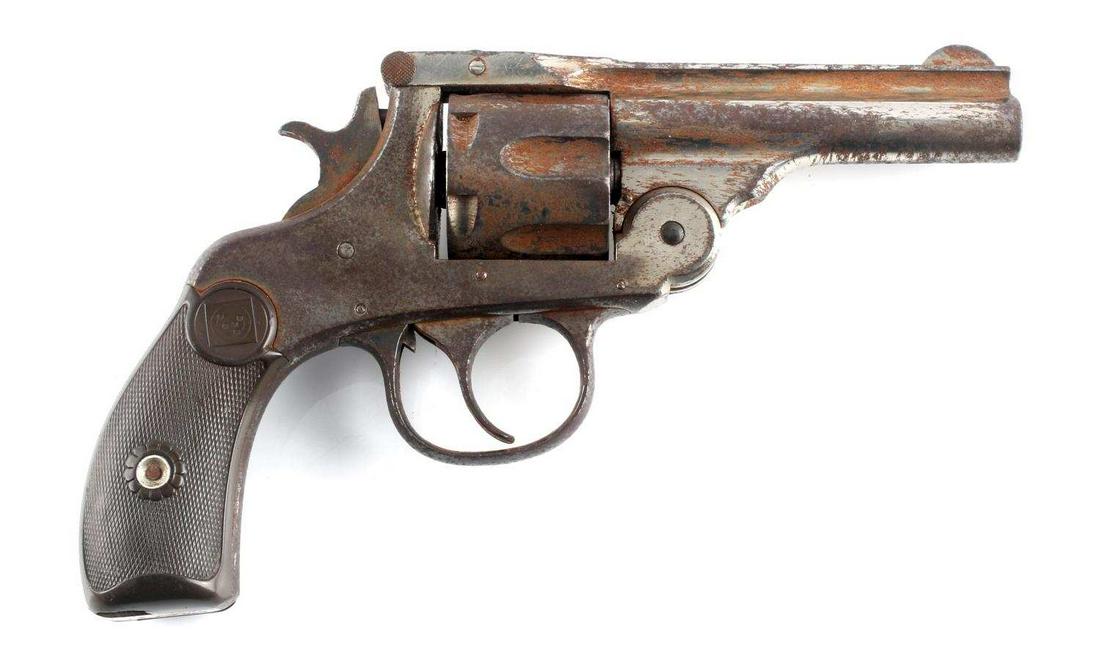 HARRINGTON & RICHARDSON TOP BREAK REVOLVER .32 CAL: 6 shot top-break revolver with nickel finish, heavy oxidation, maker marked to top rib, 3.25 inch barrel with fair bore, some pitting, bakelite grips. Serial number to butt and last three numbers mark